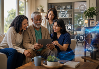 A healthcare professional helps an older man use a tablet, with family members nearby and icons representing connected care
